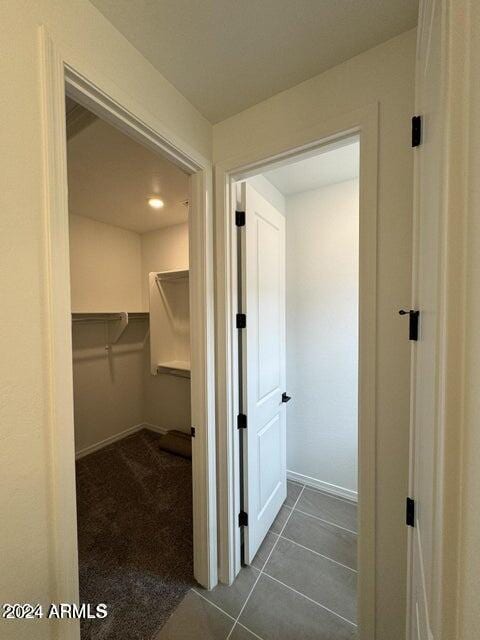 interior space with dark tile patterned floors