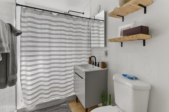 1111 E Turney Ave Unit 3, Phoenix, AZ 85014 - bathroom featuring toilet, vanity, wood finished floors, and curtained shower