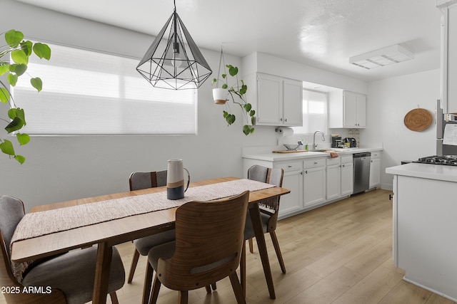 1111 E Turney Ave Unit 3, Phoenix, AZ 85014 - dining room with light wood-style flooring