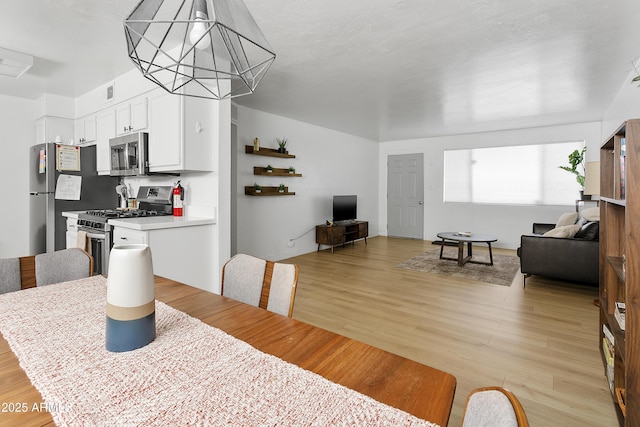 1111 E Turney Ave Unit 3, Phoenix, AZ 85014 - dining room with light wood-style floors