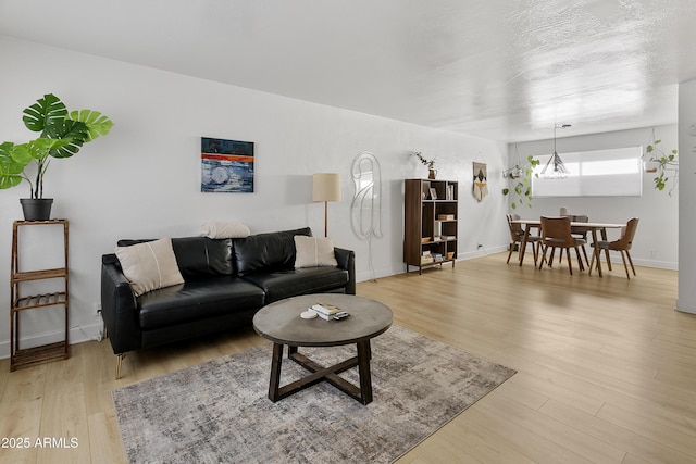 1111 E Turney Ave Unit 3, Phoenix, AZ 85014 - living area with light wood finished floors and baseboards