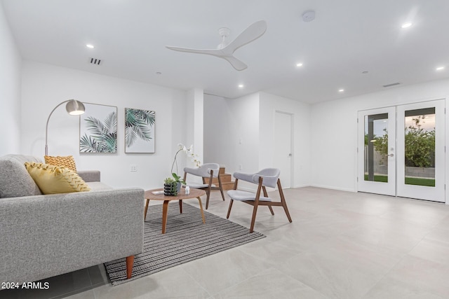 living room featuring french doors and ceiling fan