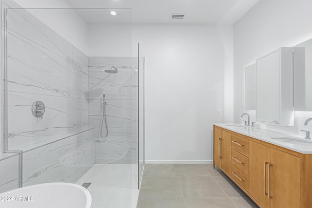 bathroom featuring vanity, tile patterned floors, and plus walk in shower