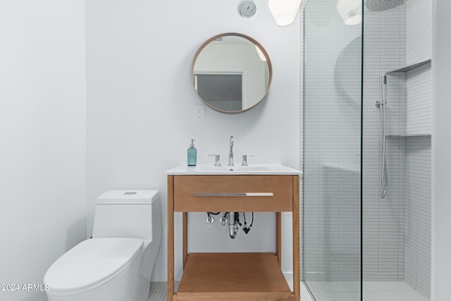 bathroom with toilet, an enclosed shower, and sink