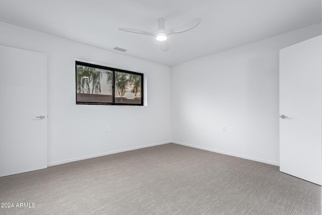 empty room featuring carpet and ceiling fan