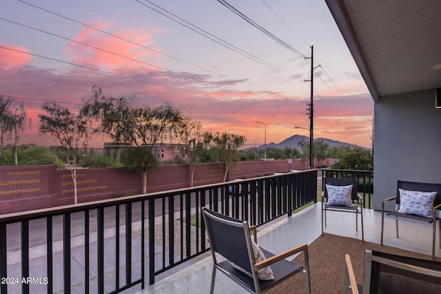 view of balcony at dusk