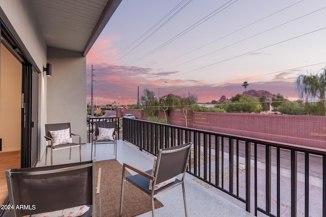 view of balcony at dusk