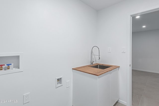 laundry room with hookup for a washing machine and sink