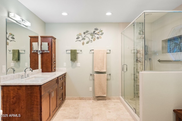 bathroom with vanity and an enclosed shower