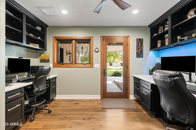 office space featuring light hardwood / wood-style floors and ceiling fan