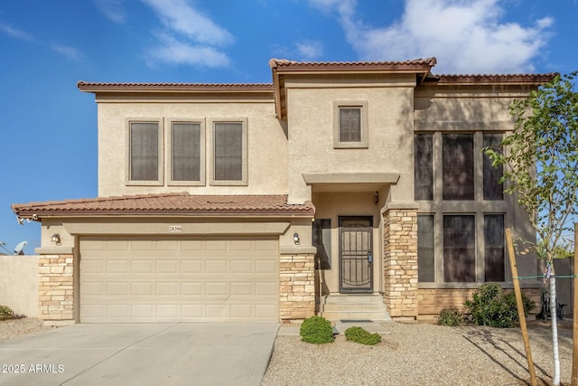 mediterranean / spanish house featuring a garage