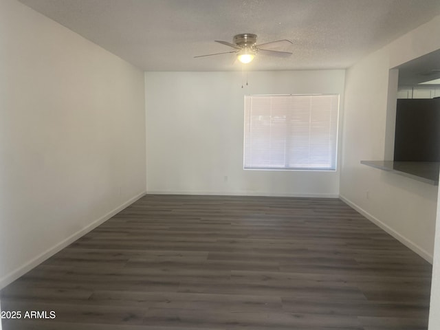 1452 E Emerald Ave, Mesa, AZ 85204 - empty room featuring wood finished floors, a ceiling fan, and baseboards