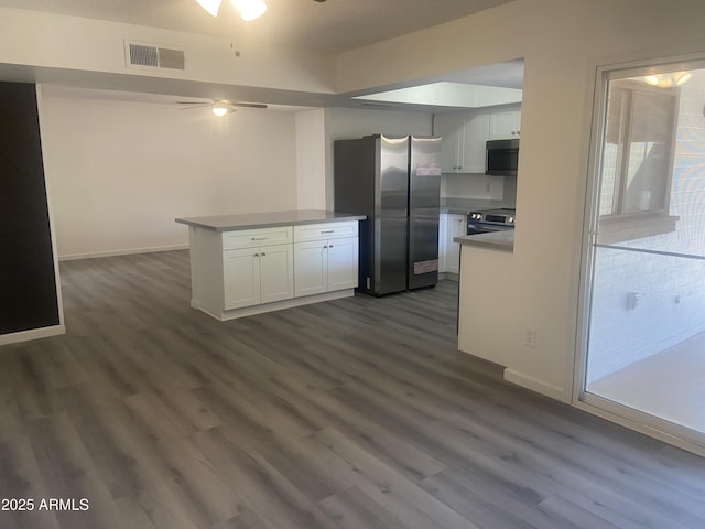 1452 E Emerald Ave, Mesa, AZ 85204 - kitchen with stainless steel appliances, ceiling fan, white cabinetry, dark wood-style flooring, and a peninsula