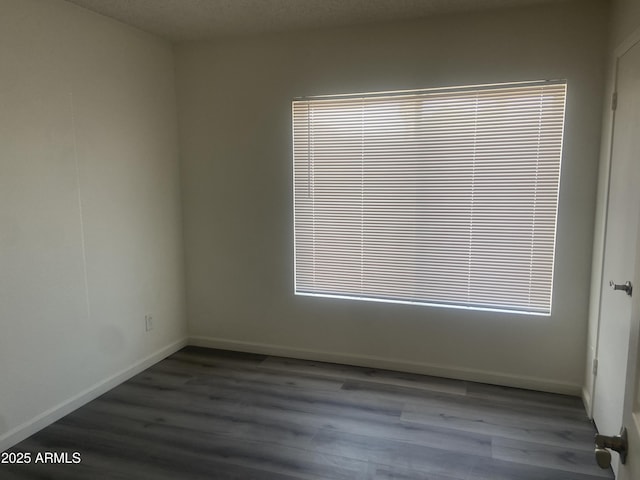 1452 E Emerald Ave, Mesa, AZ 85204 - unfurnished room with wood finished floors and baseboards