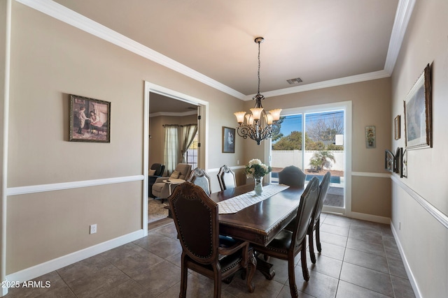 tiled dining space with crown molding and a chandelier