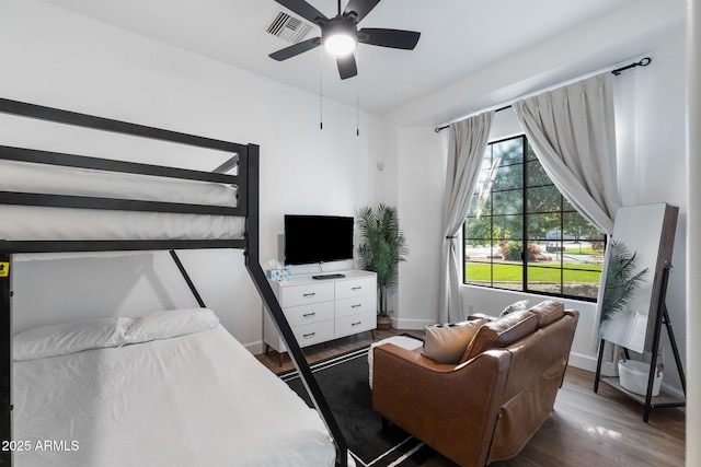 bedroom featuring dark hardwood / wood-style floors and ceiling fan