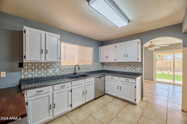 kitchen featuring decorative backsplash, dishwasher, ceiling fan, and white cabinetry