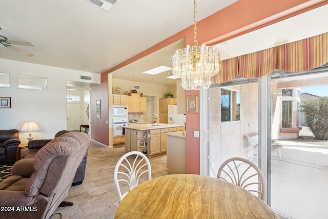 dining area with visible vents and ceiling fan with notable chandelier