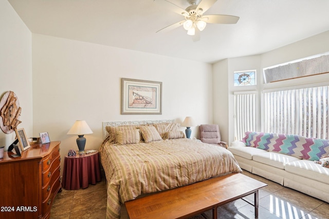 bedroom featuring a ceiling fan and tile patterned floors