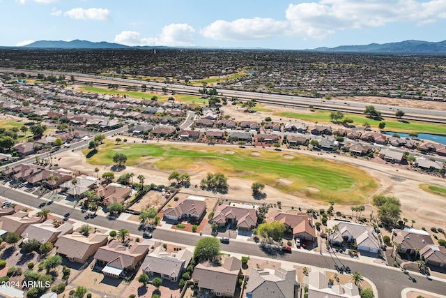 birds eye view of property with view of golf course, a residential view, and a mountain view