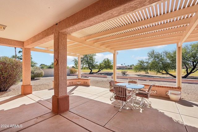 view of patio / terrace with outdoor dining area and a pergola