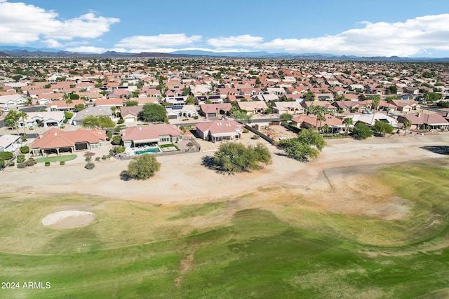 bird's eye view with view of golf course, a residential view, and a mountain view