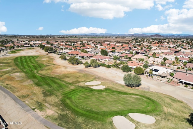 birds eye view of property featuring view of golf course, a residential view, and a mountain view