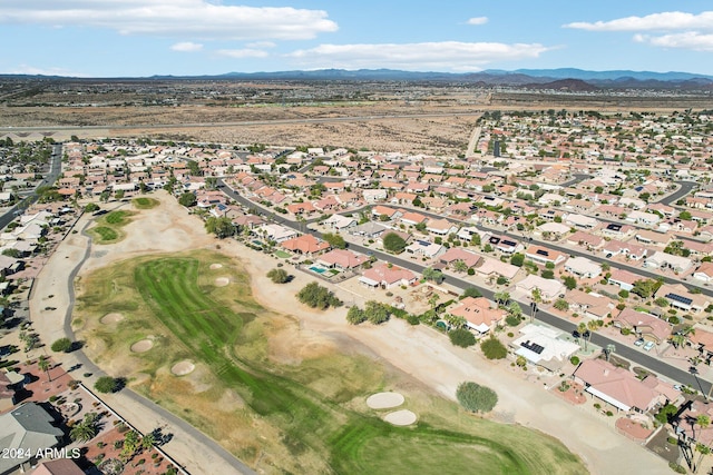 birds eye view of property with view of golf course, a residential view, and a mountain view