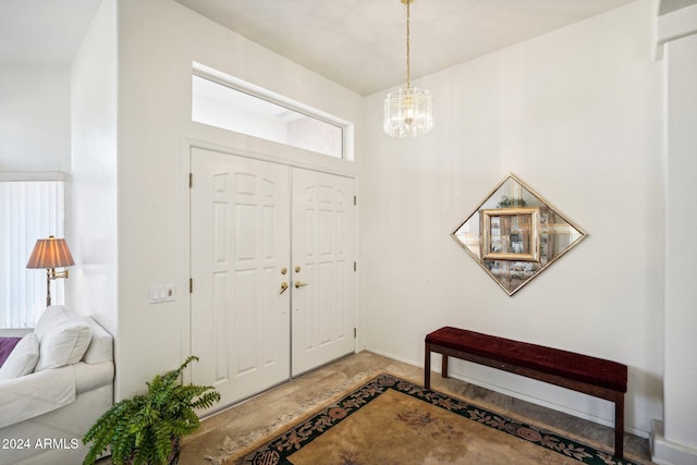 entrance foyer featuring an inviting chandelier