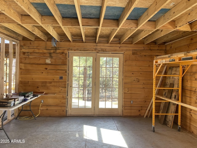 misc room featuring wood walls