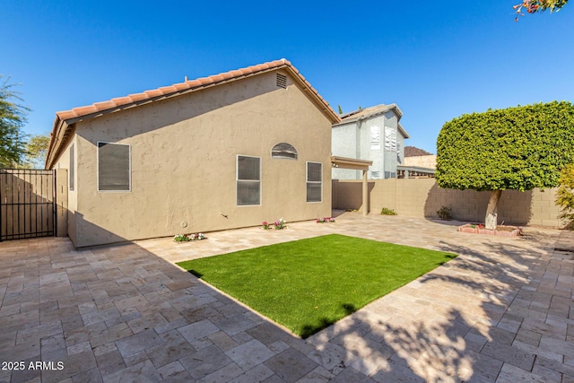 back of house with a patio area