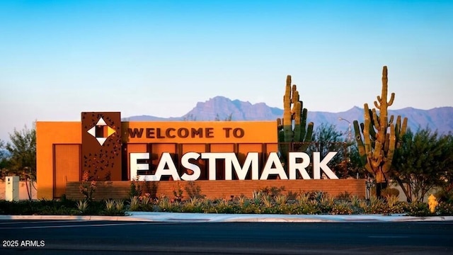 community sign featuring a mountain view