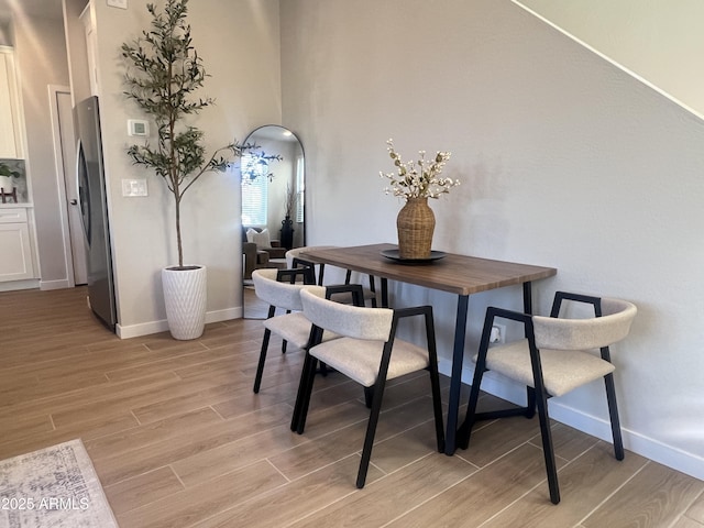 dining space featuring light hardwood / wood-style floors