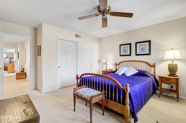 18919 E Reata Ln, Rio Verde, AZ 85263 - bedroom featuring light carpet, a closet, visible vents, and baseboards