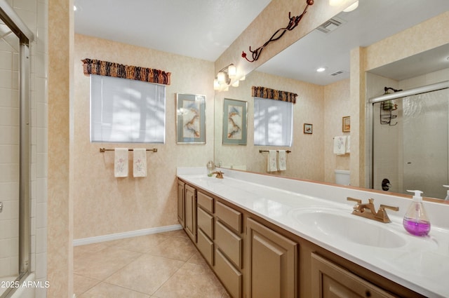 18919 E Reata Ln, Rio Verde, AZ 85263 - full bathroom with double vanity, visible vents, toilet, tile patterned flooring, and a sink