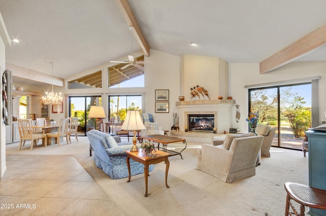 living room featuring plenty of natural light, a fireplace, beamed ceiling, and light tile patterned flooring