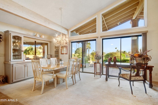 18919 E Reata Ln, Rio Verde, AZ 85263 - dining area with an inviting chandelier, beam ceiling, a wealth of natural light, and light colored carpet