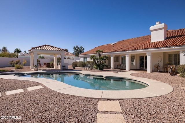 view of swimming pool with a fenced in pool, a fenced backyard, a patio, and a gazebo