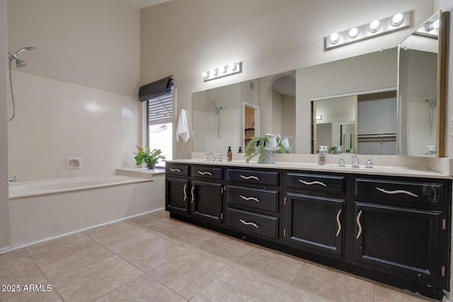 bathroom with vanity and tile patterned flooring