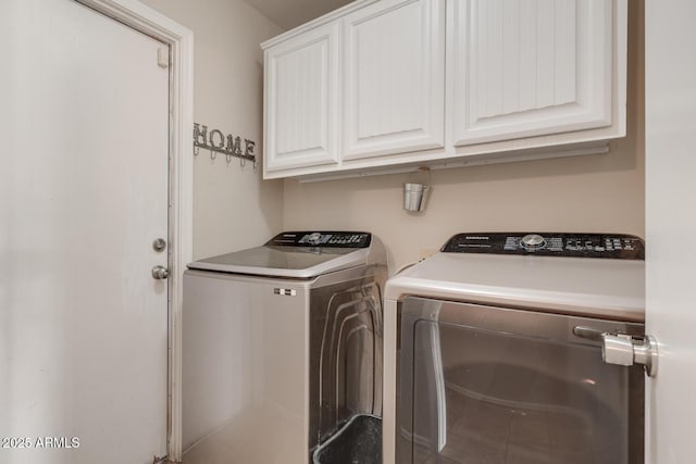 laundry area with cabinets and washer and dryer