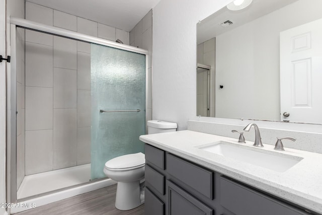 full bathroom featuring visible vents, a stall shower, and toilet