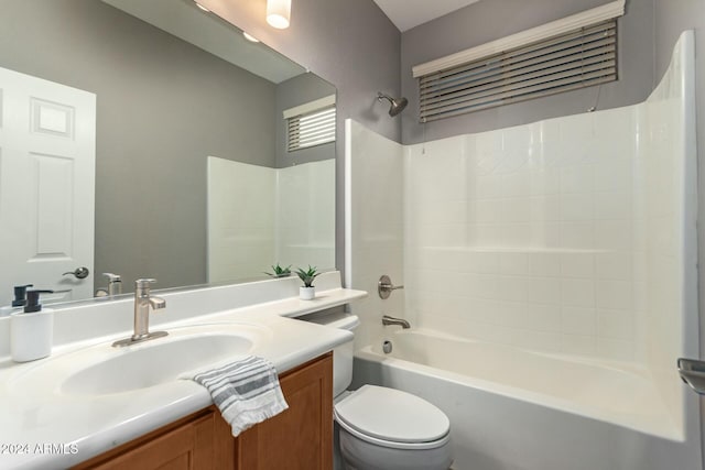 full bathroom featuring toilet, vanity, and bathing tub / shower combination