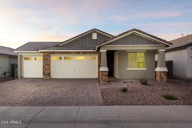 craftsman house with a garage