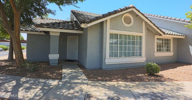 860 N Mcqueen Rd Unit 1157, Chandler, AZ 85225 - view of front of home with a tile roof and stucco siding