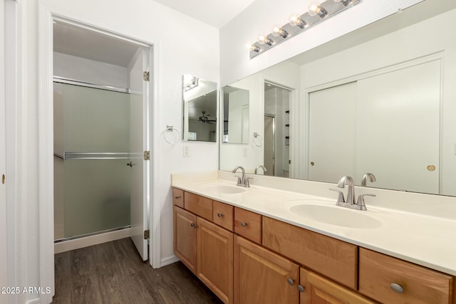 860 N Mcqueen Rd Unit 1157, Chandler, AZ 85225 - bathroom featuring wood finished floors, double vanity, and an enclosed shower