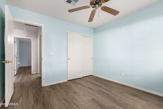 860 N Mcqueen Rd Unit 1157, Chandler, AZ 85225 - unfurnished bedroom featuring wood finished floors, baseboards, a closet, and a ceiling fan