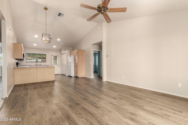 860 N Mcqueen Rd Unit 1157, Chandler, AZ 85225 - unfurnished living room with dark wood-style floors, recessed lighting, a sink, a ceiling fan, and vaulted ceiling