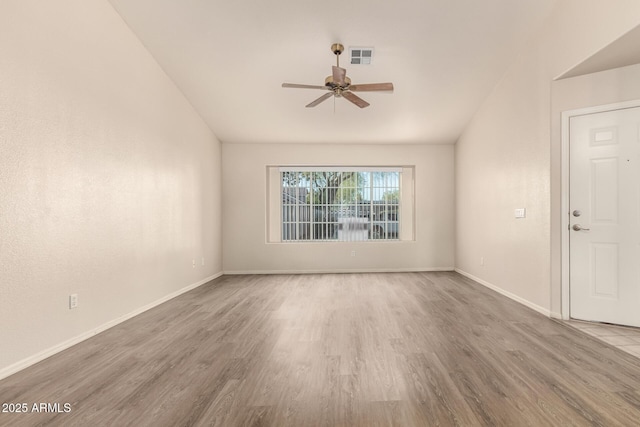 860 N Mcqueen Rd Unit 1157, Chandler, AZ 85225 - spare room featuring wood finished floors, a ceiling fan, baseboards, and vaulted ceiling