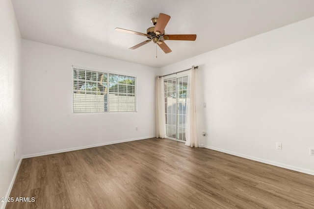 860 N Mcqueen Rd Unit 1157, Chandler, AZ 85225 - spare room with wood finished floors, ceiling fan, and baseboards