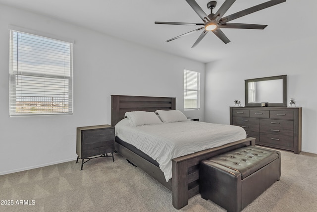 bedroom featuring ceiling fan and light carpet